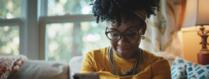 A woman who is a regular donor receives a text message on her mobile phone from a nonprofit organization